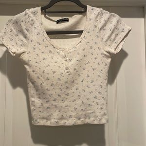 Brandy Melville white Zelly top with light blue flowers